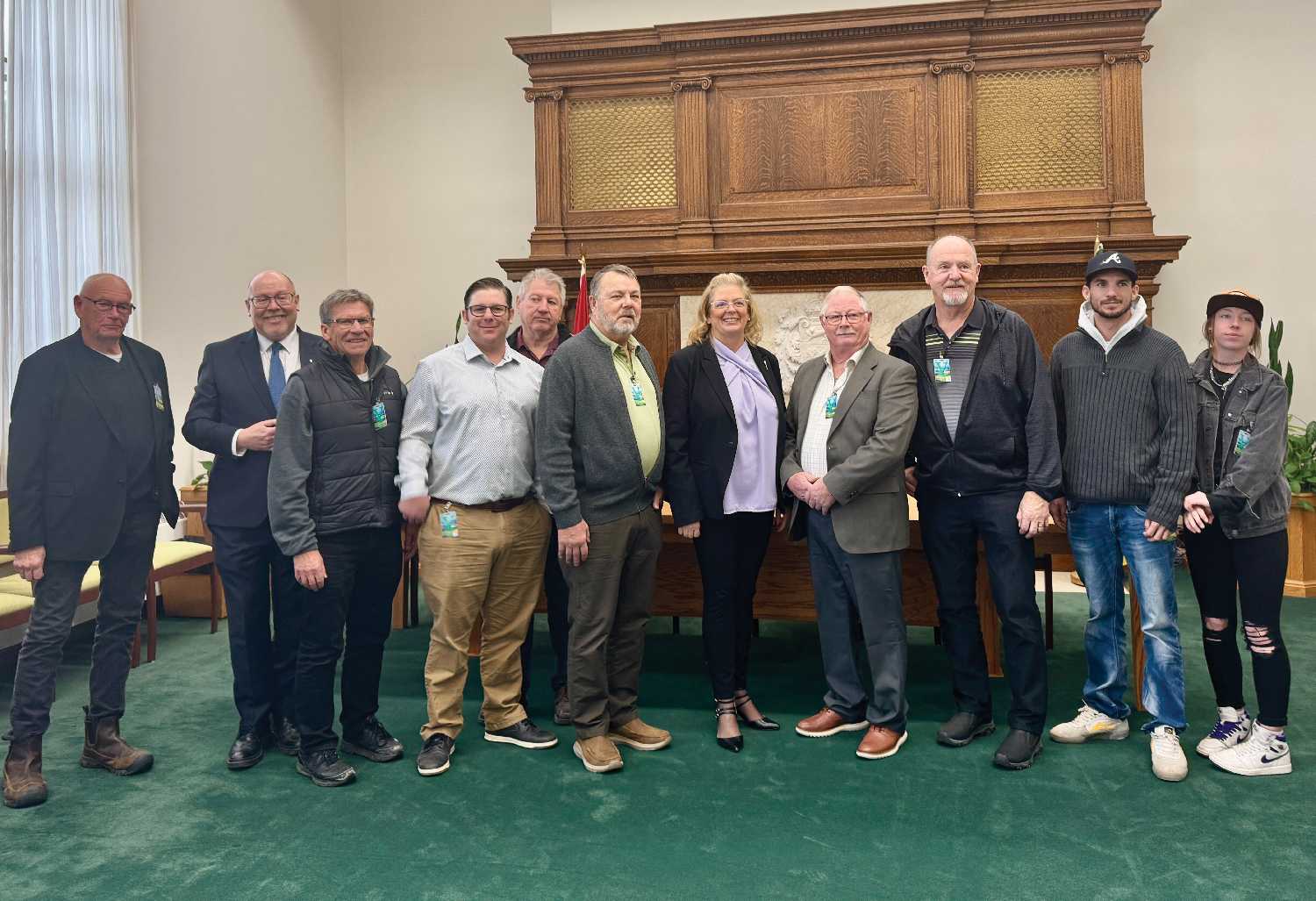 Minister of Mental Health and Addictions, Seniors and Rural and Remote Health Lori Carr, centre, and Moosomin-Montmartre MLA Kevin Weedmark, second from left, with some of the people from the Moosomin-Montmarte constituency who were at the Legislature Friday to see the compassionate intervention legislation introduced.